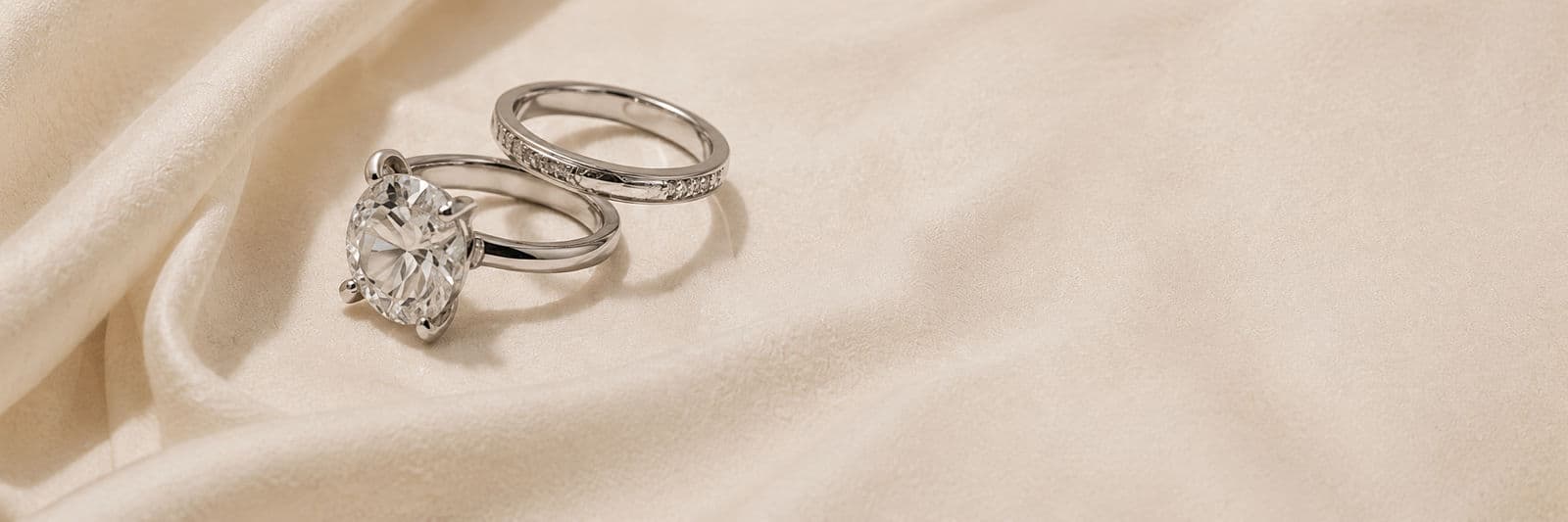 Bespoke rings resting on silk